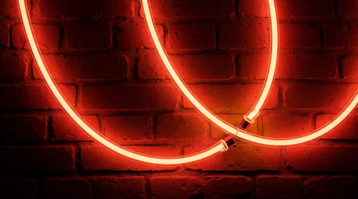 Neon signs glow because electricity passes through the gas - neon is so unreactive it just sits in the tube for years